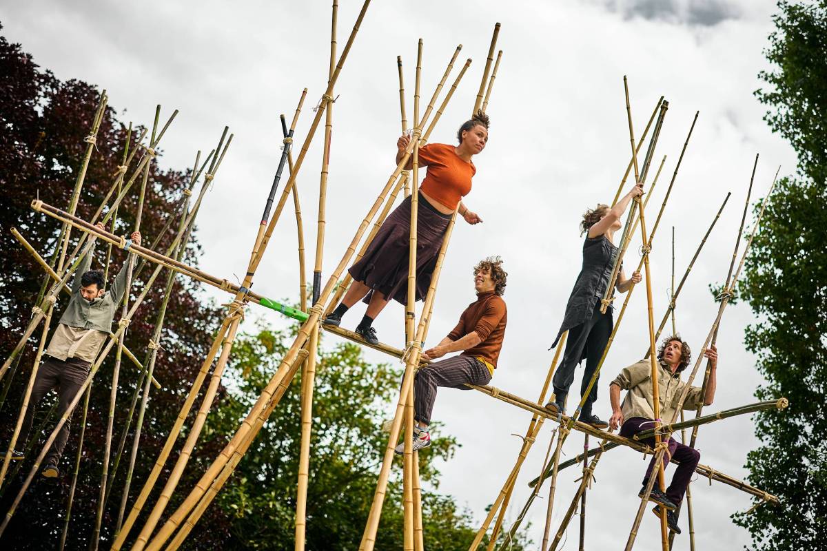 Acrobats climbing on bamboo structures